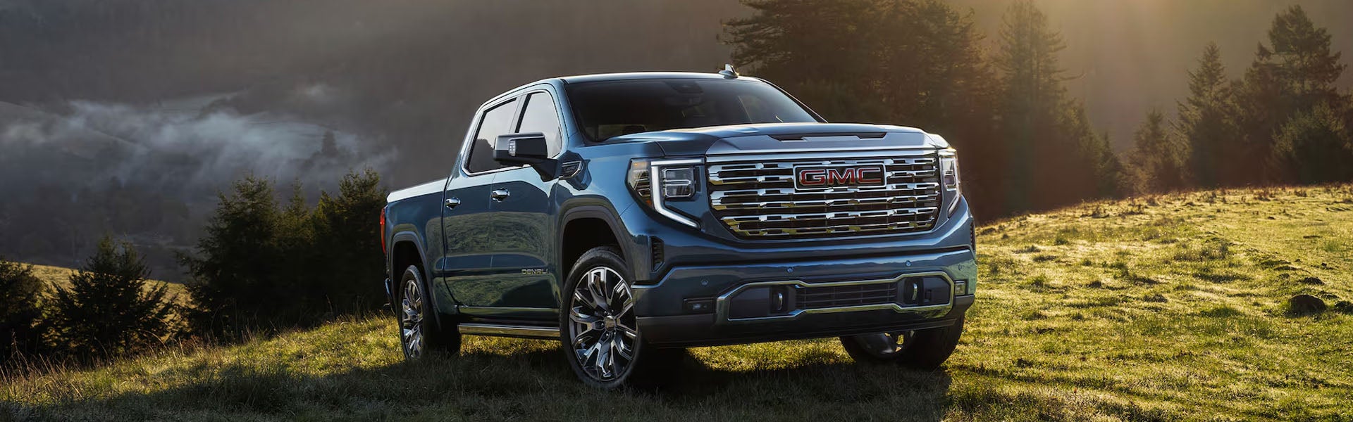 Blue GMC Sierra 1500 pickup truck outdoors