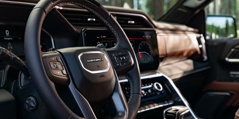 2026 GMC Sierra 1500 steering wheel and dashboard.