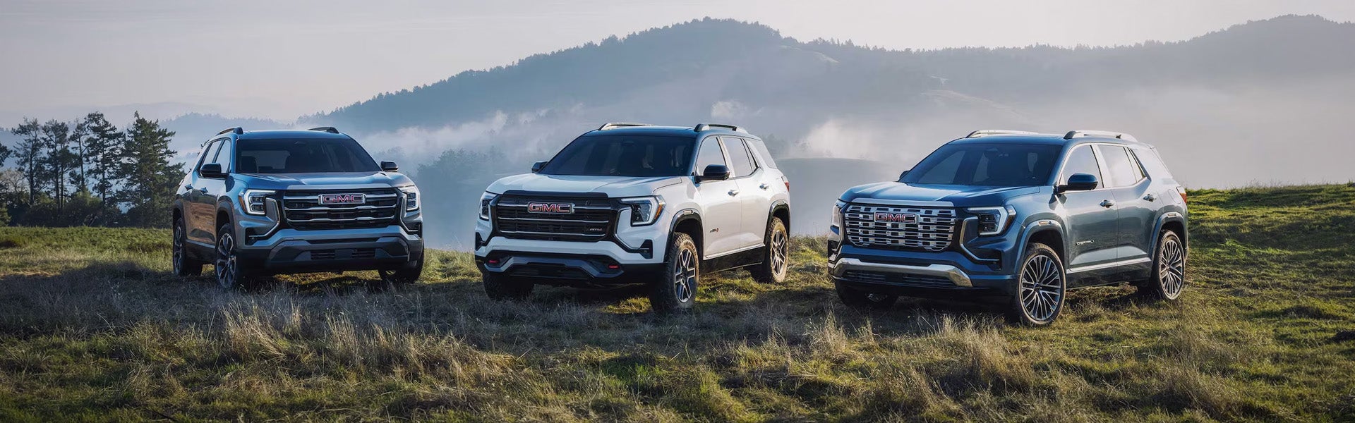 Front view of 2026 GMC Terrain SUVs outdoors